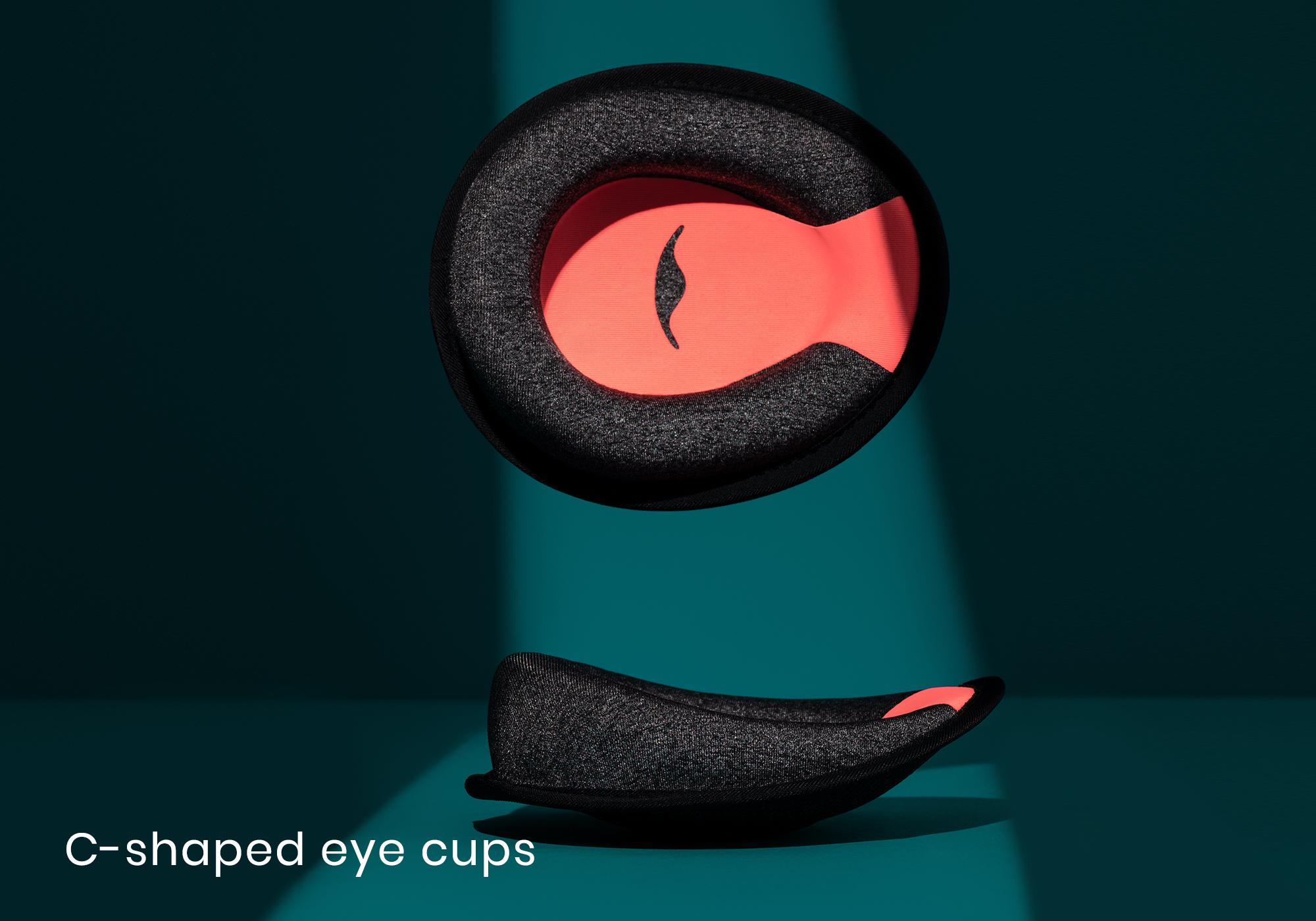 A black and red C-shaped eye cup shown in a front view with another C-shaped eye cup below.