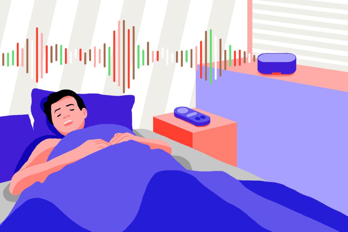 A man is relaxing in bed, listening to different kinds of colored noise using a white noise machine.
