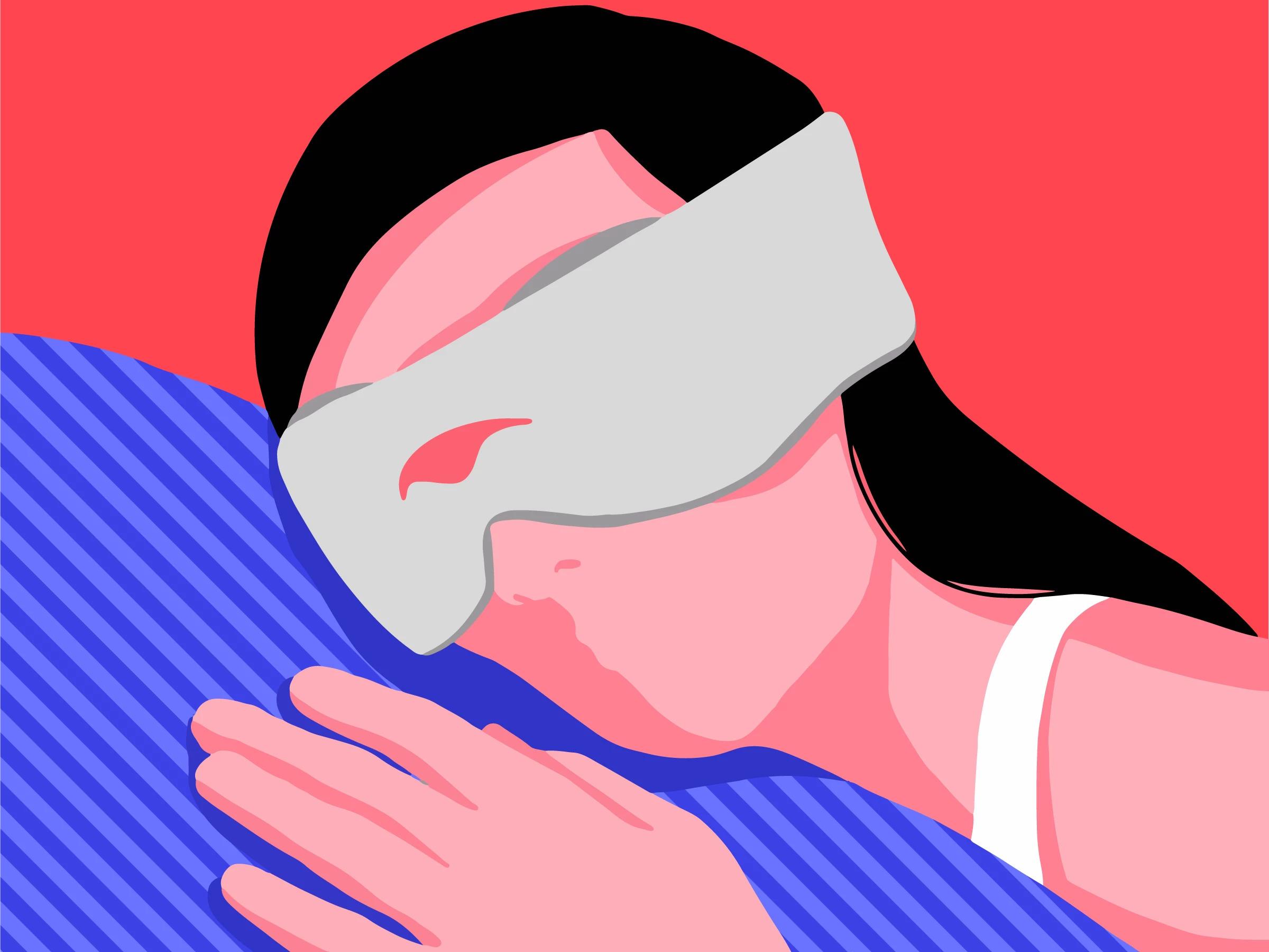 A girl sleeping on her side wearing the best sleep mask for side sleepers with eye cups.