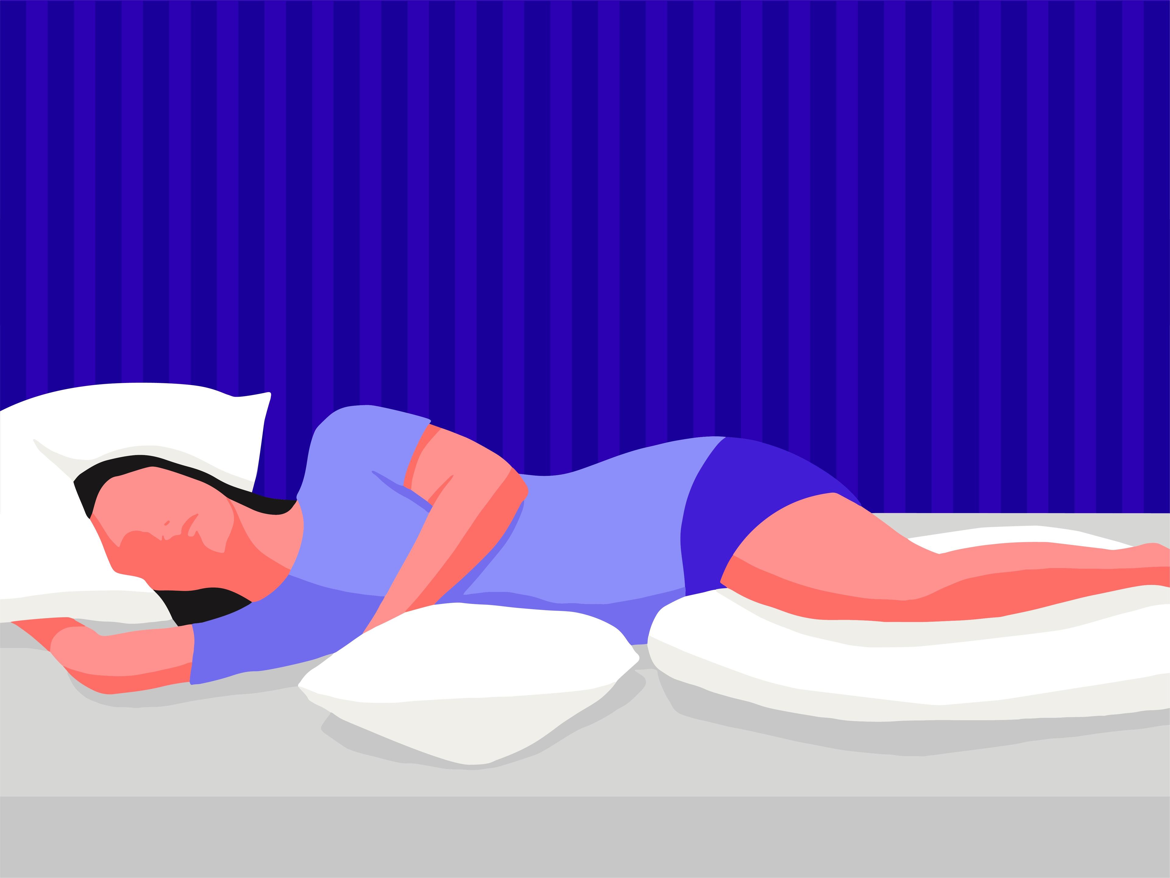 A person with sciatica sleeping on their side with a pillow under the head, waist and between the legs.