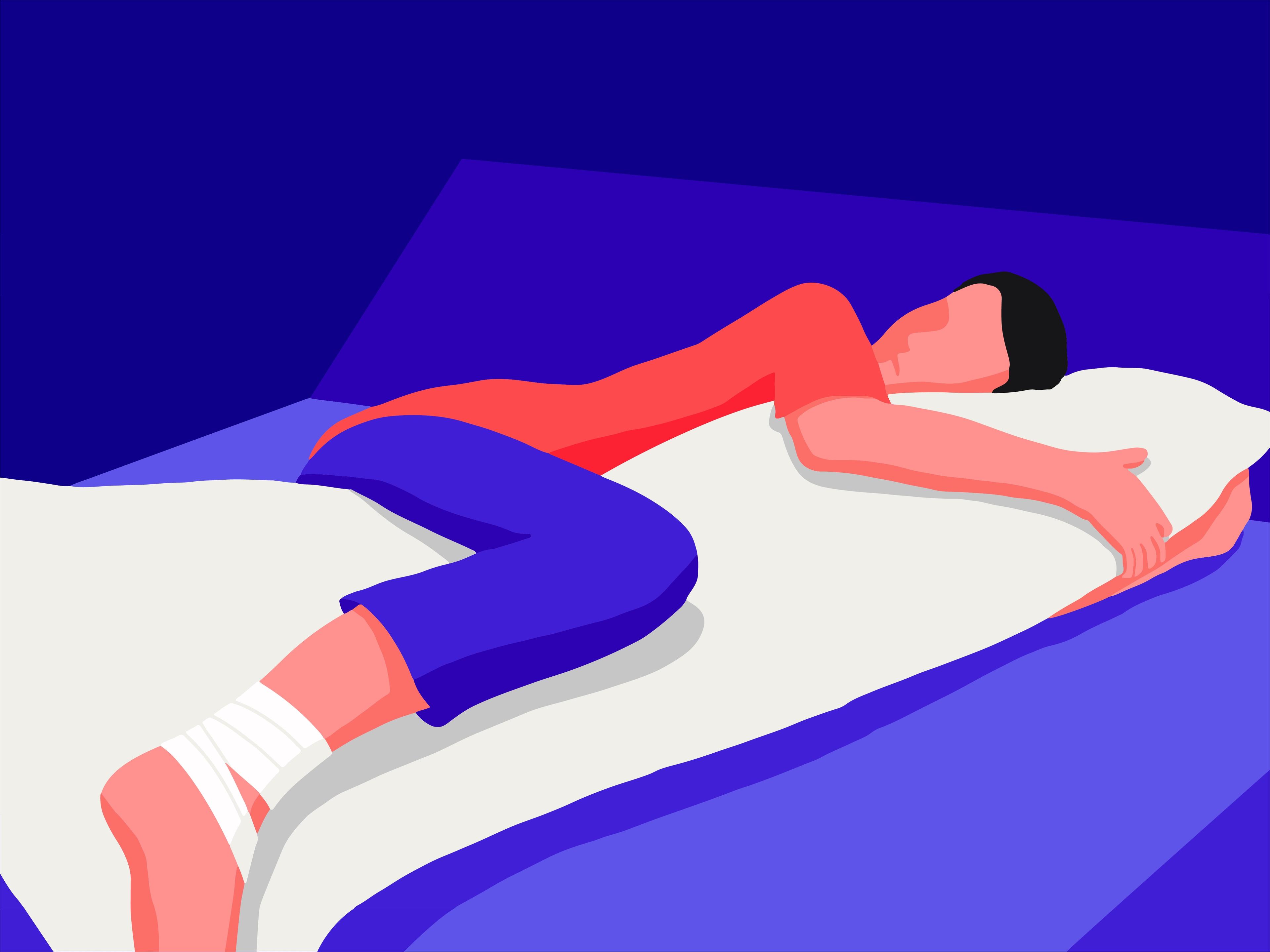 A guy with a sprained ankle sleeping on his side using a body pillow.