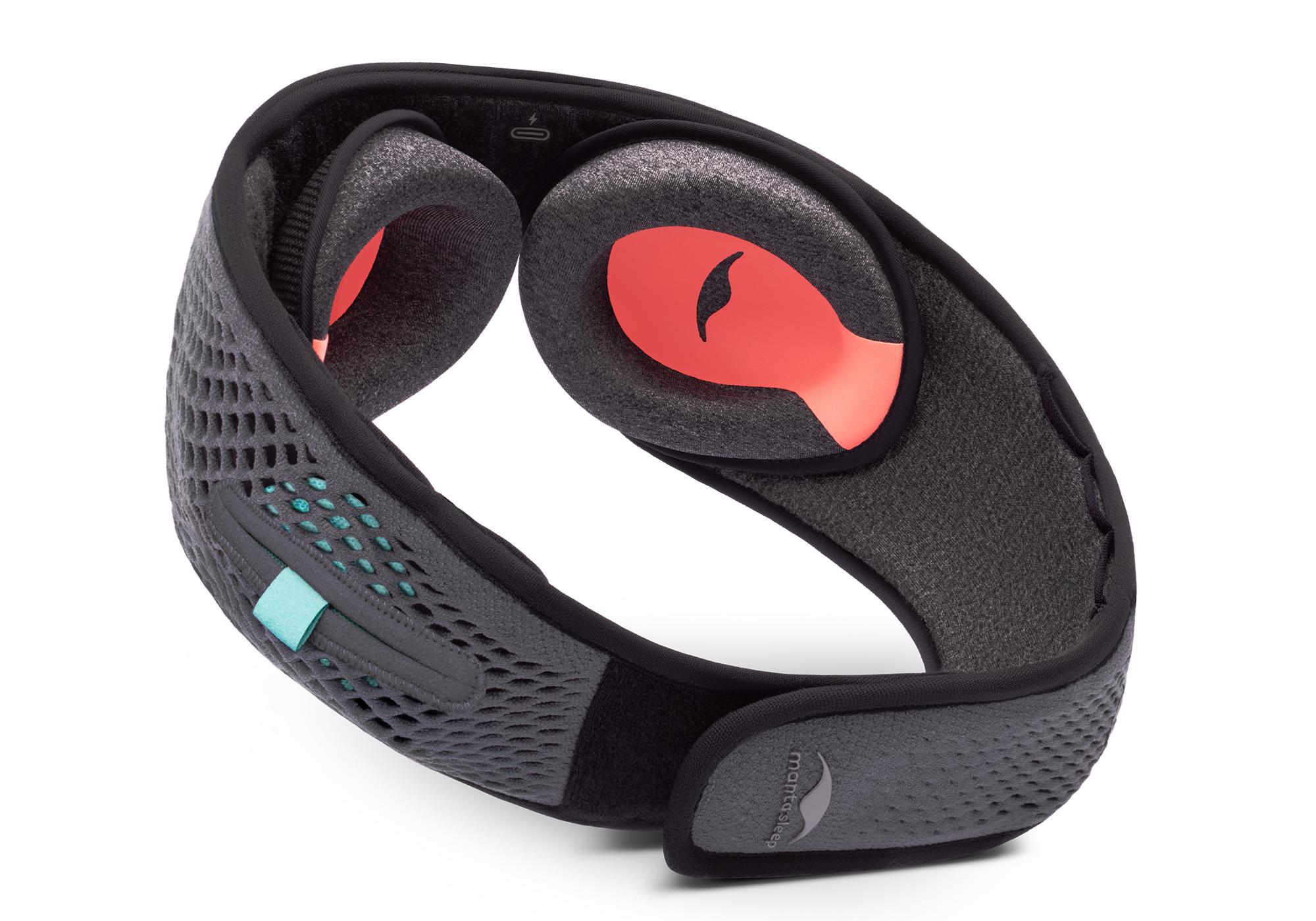 The interior of a gray mesh Bluetooth sleep mask with C-shaped eye cups.