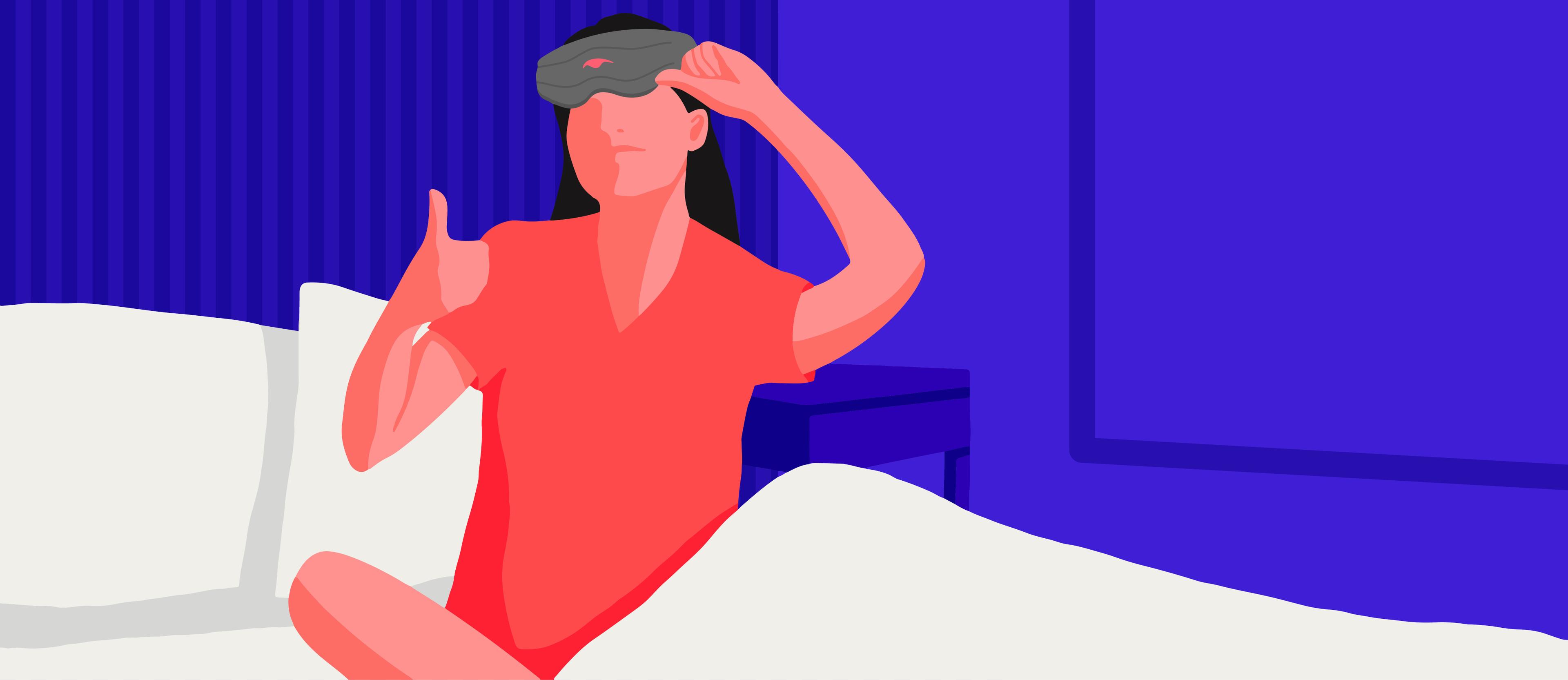 A girl giving a thumbs up wearing a weighted sleep mask.