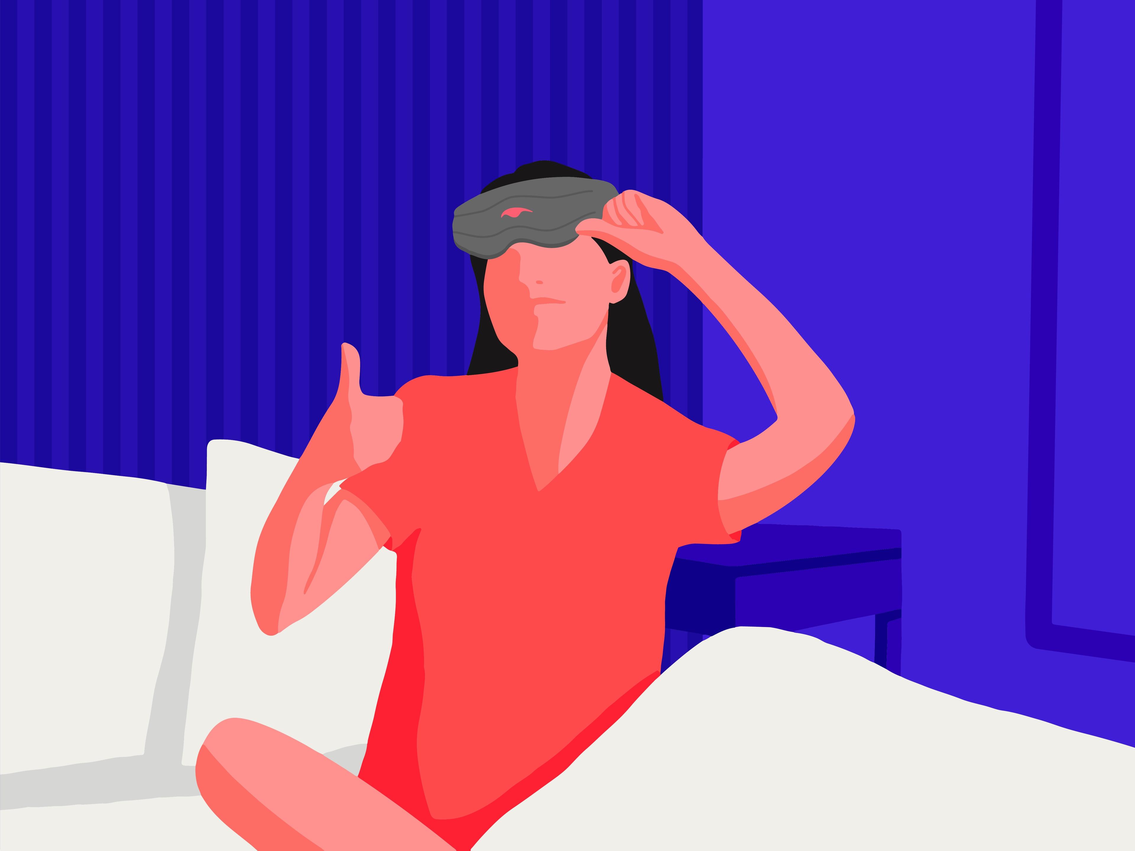 A girl giving a thumbs up wearing a weighted sleep mask.